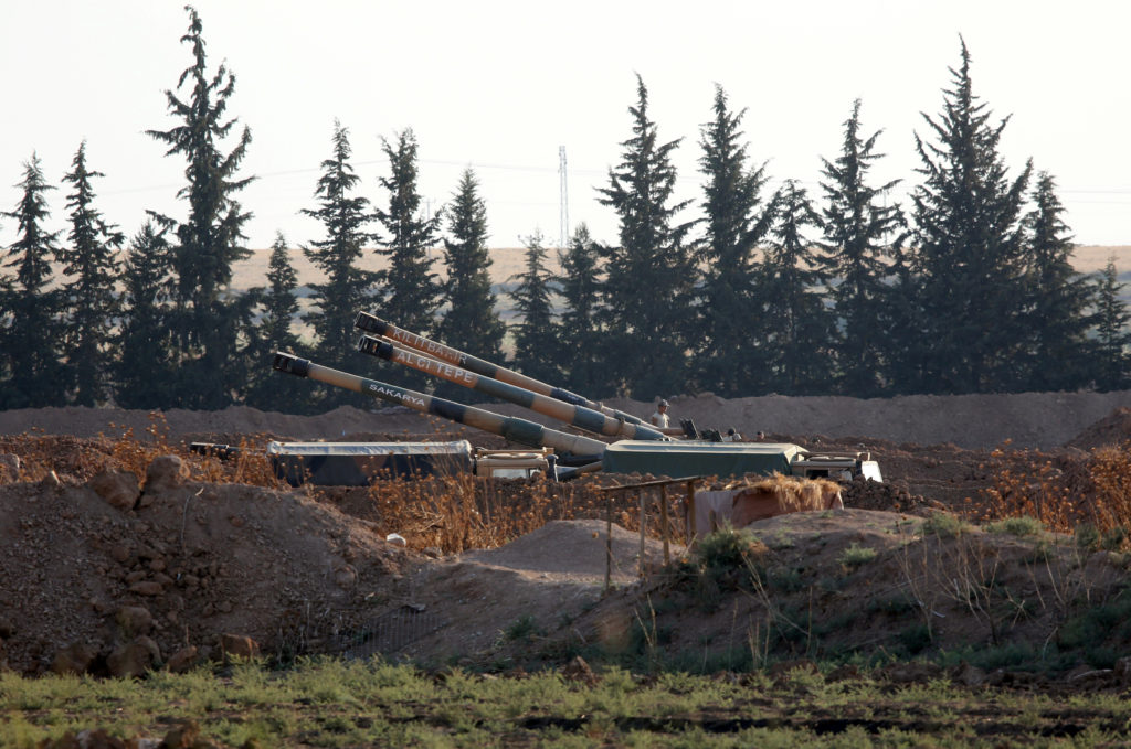 Turkish army howitzers are positioned on the Turkish-Syrian border, near the southeastern town of Akcakale in Sanliurfa pr...