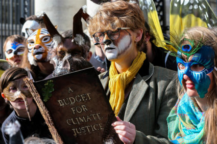 Extinction Rebellion protestor Leontien Friel Darrell reads a Budget for Climate Justice outside Government Buildings on Budget day in Dublin, Ireland October 8, 2019. Photo by Lorraine O'Sullivan/Reuters