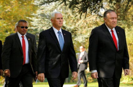 U.S. Vice President Mike Pence and U.S. Secretary of State Mike Pompeo walk at the residence of U.S. ambassador in Ankara, Turkey, October 17, 2019. Photo by Huseyin Aldemir/Reuters