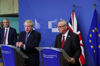 Britain's Brexit Secretary Stephen Barclay, European Commission President Jean-Claude Juncker and Britain's Prime Minister Boris Johnson attend a news conference after agreeing on the Brexit deal, at the sidelines of the European Union leaders summit, in Brussels, Belgium October 17, 2019. Photo by Yves Herman/Reuters