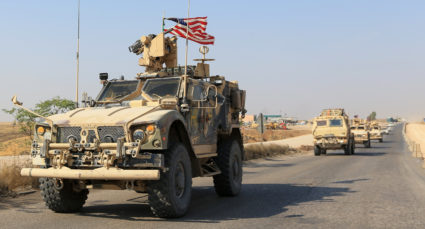 A convoy of U.S. vehicles is seen after withdrawing from northern Syria, on the outskirts of Dohuk, Iraq, October 21, 2019. Photo by Ari Jalal/Reuters