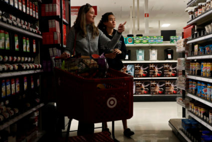 Solveig Woo (L) and daughter Katherine shop for supplies inside a darkened Target store during Pacific Gas &amp; Electric's Public Safety Power Shutoff (PSPS) in Novato, California, U.S. October 29, 2019. Photo by Stephen Lam/Reuters
