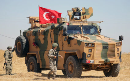 A Turkish soldier walks next to a Turkish military vehicle during a joint U.S.-Turkey patrol, near Tel Abyad, Syria September 8, 2019. Photo by Rodi Said/Reuters