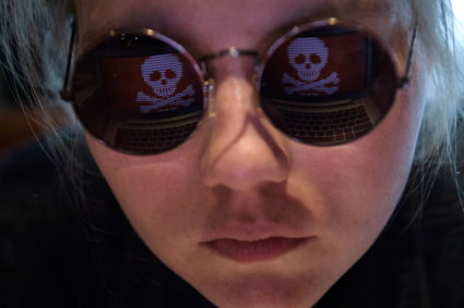 A reflection of a computer hacked by a virus known as Petya. Petya -- a family of ransomware -- infected a string of U.S. hospitals and the drug company Merck in 2017. Photo by Donat Sorokin/TASS via Getty Images