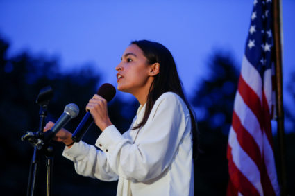 Representative Alexandria Ocasio-Cortez speaks to people as they gather for a vigil to remember victims of the mass shootings at Dayton and El Paso, at Grand Army Plaza in Brooklyn, New York, U.S., August 5, 2019. REUTERS/Eduardo Munoz