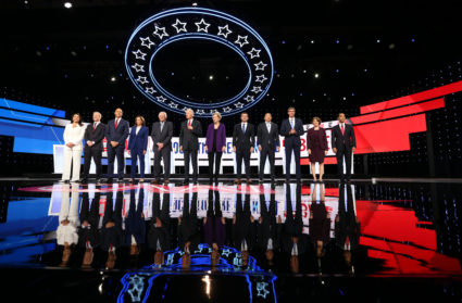 Democratic presidential candidates Rep. Tulsi Gabbard, billionaire activist Tom Steyer, Senator Cory Booker, Senator Kamala Harris, Senator Bernie Sanders, former Vice President Joe Biden, Senator Elizabeth Warren, South Bend Mayor Pete Buttigieg, entrepreneur Andrew Yang, former Rep. Beto O''Rourke, Senator Amy Klobuchar and former Housing Secretary Julian Castro pose together at the start of the fourth Democratic U.S. 2020 presidential election debate at Otterbein University in Westerville, Ohio October 15, 2019. REUTERS/Aaron Josefczyk