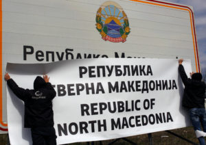 Workers set up a sign with the new name at the border between Macedonia and Greece, near Gevgelija, on February 13, 2019. The sign reads: "Republic of North Macedonia." Photo by Ognen Teofilovski/Reuters