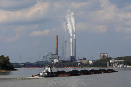 A towboat pushes barges towards the Mill Creek Station power plant on the Ohio River in Louisville, Kentucky, U.S., September 15, 2017. According to the company, Louisville Gas and Electric, Mill Creek Station is a coal-fired power plant producing over 1400 megawatts of power and burning approximately 4.8 million tons of coal per year. Photo by Brian Snyder/Reuters