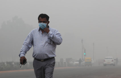 A man wearing a mask walks on a smoggy morning in New Delhi, November 3, 2019. Photo by Adnan Abidi/Reuters