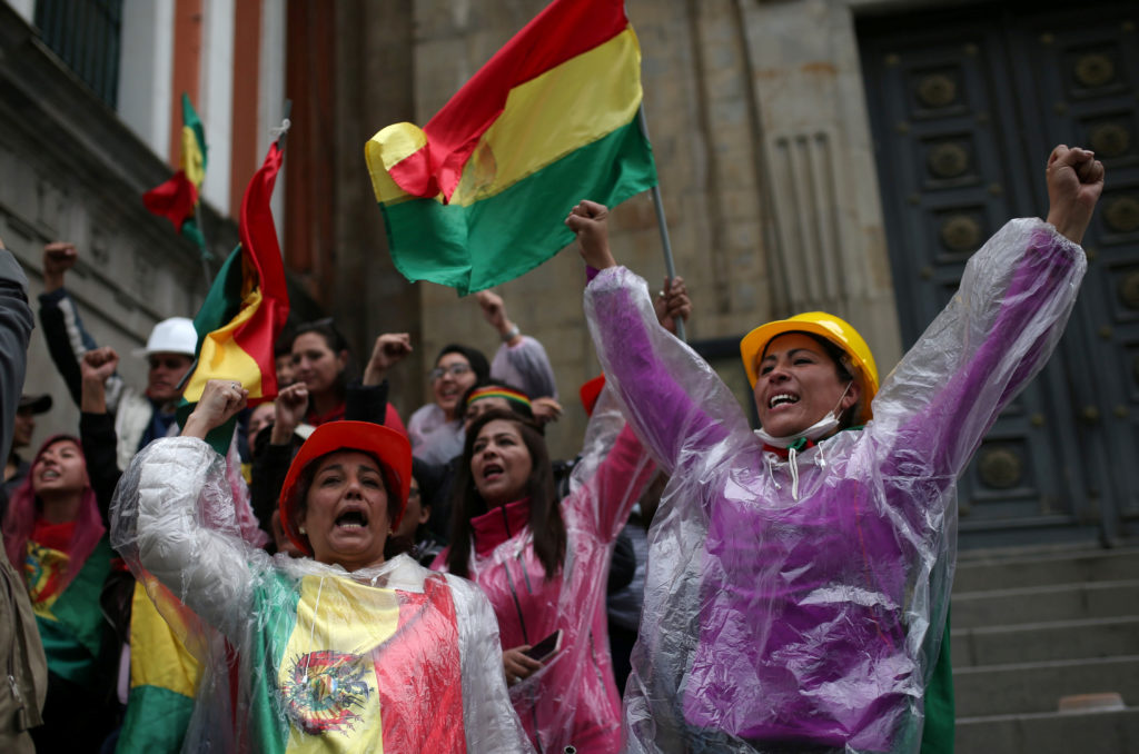 People celebrate after Bolivia's President Evo Morales announced his resignation in La Paz, Bolivia on November 10, 2019. ...
