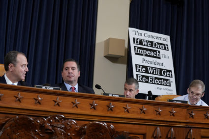 House Intelligence Committee Chairman Adam Schiff (D-CA) looks past ranking member Devin Nunes (R-CA) and a committee attorney at newly installed Republican committee member Rep. Jim Jordan (R-OH) at the start of the first open House Intelligence Committee impeachment inquiry hearing into U.S. President Donald Trump on Capitol Hill in Washington, U.S., November 13, 2019. Photo by Jonathan Ernst/Reuters