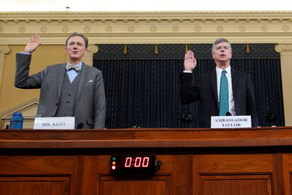 George Kent, deputy assistant secretary of state for European and Eurasian Affairs, and Ambassador Bill Taylor, charge d'affaires at the U.S. embassy in Ukraine;are sworn in at at a House Intelligence Committee hearing as part of the impeachment inquiry into U.S. President Donald Trump on Capitol Hill in Washington, U.S., November 13, 2019. Photo by Joshua Roberts/Pool/Reuters.