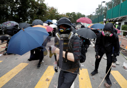 FILE PHOTO: Demonstrators stand with shields and umbrellas during an anti-government protest at the Chinese University of Hong Kong in Sha Tin, Hong Kong, China November 12, 2019. Photo by Shannon Stapleton/Reuters