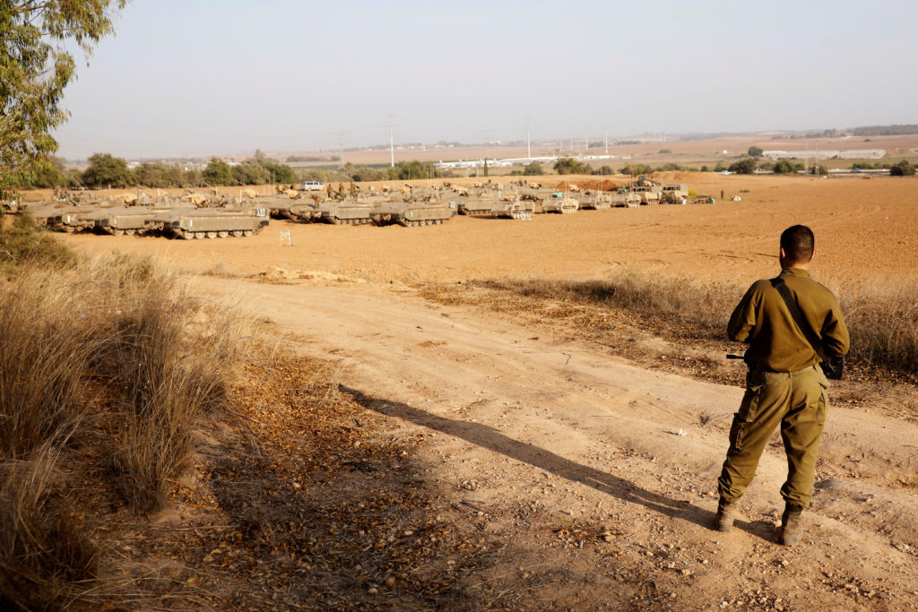 An Israeli soldier stands near a staging area near the border with Gaza, in southern Israel November 14, 2019. Photo by Ro...
