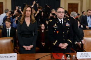 Jennifer Williams, a special adviser to Vice President Mike Pence for European and Russian affairs and Lt. Colonel Alexander Vindman, director for European Affairs at the National Security Council, take their seats to testify before a House Intelligence Committee hearing as part of the impeachment inquiry into U.S. President Donald Trump on Capitol Hill in Washington, U.S., November 19, 2019. REUTERS/Erin Scott
