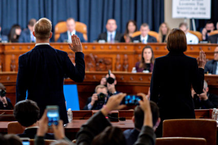 David Holmes, political counselor at the U.S Embassy in Kiev, and Fiona Hill, former senior director for Europe and Russia on the National Security Council, are sworn in before testifying in front of the House Intelligence Committee, as part of the impeachment inquiry into U.S. President Donald Trump on Capitol Hill, in Washington, U.S., November 21, 2019. Andrew Harrer/Pool via Reuters