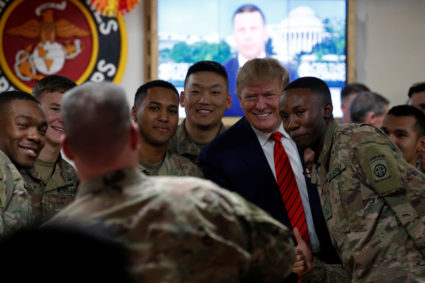 U.S. President Donald Trump takes a photo with U.S. troops during a surprise visit at Bagram Air Base in Afghanistan, November 28, 2019. Photo by Tom Brenner/Reuters