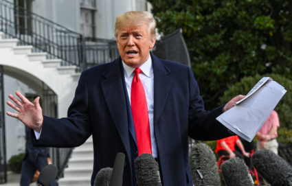 U.S. President Donald Trump holds what appears to be a prepared statement and handwritten notes after watching testimony by U.S. Ambassador to the European Union Gordon Sondland at House Intelligence Committee impeachment hearings, as he speaks to reporters prior to departing for travel to Austin, Texas from the South Lawn of the White House in Washington, U.S., November 20, 2019. REUTERS/Erin Scott