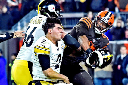 Cleveland Browns defensive end Myles Garrett (95) hits Pittsburgh Steelers quarterback Mason Rudolph (2) with his own helmet as offensive guard David DeCastro (66) tries to stop Garrett during the fourth quarter at FirstEnergy Stadium. Photo by Ken Blaze-USA TODAY Sports