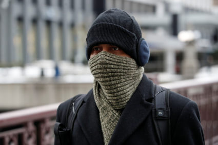 A man braves cold temperature as severe weather hits Chicago, Illinois, U.S. November 13, 2019. Photo by Kamil Krzaczynski/Reuters
