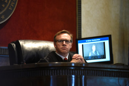 Judge Thad Balkman listens to a piece of evidence on the first day of a trial accusing Johnson &amp; Johnson of engaging in deceptive marketing that contributed to the national opioid epidemic in Norman, Oklahoma, U.S. May 28, 2019. Photo by REUTERS/Nick Oxford