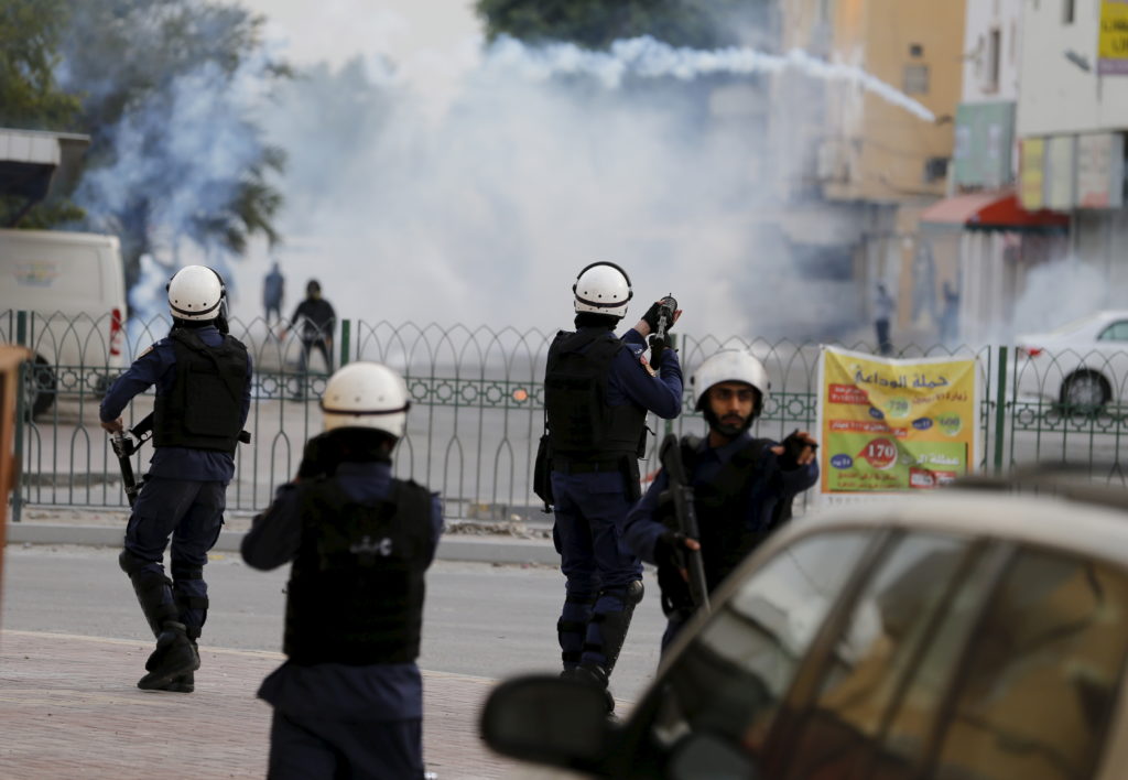 Riot police fires tear gas at protesters during clashes after a protest against the execution of prominent Shi'ite Muslim ...
