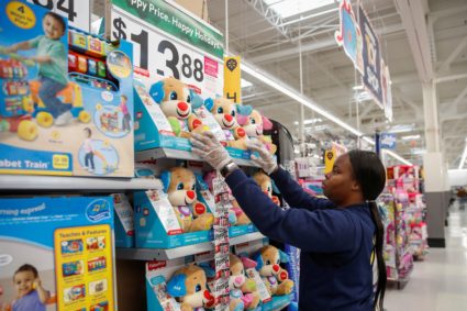 An employee puts up a toys display ahead of Black Friday at a Walmart store in Chicago, Illinois, U.S. November 27, 2019. Photo by Kamil Krzaczynski/Reuters