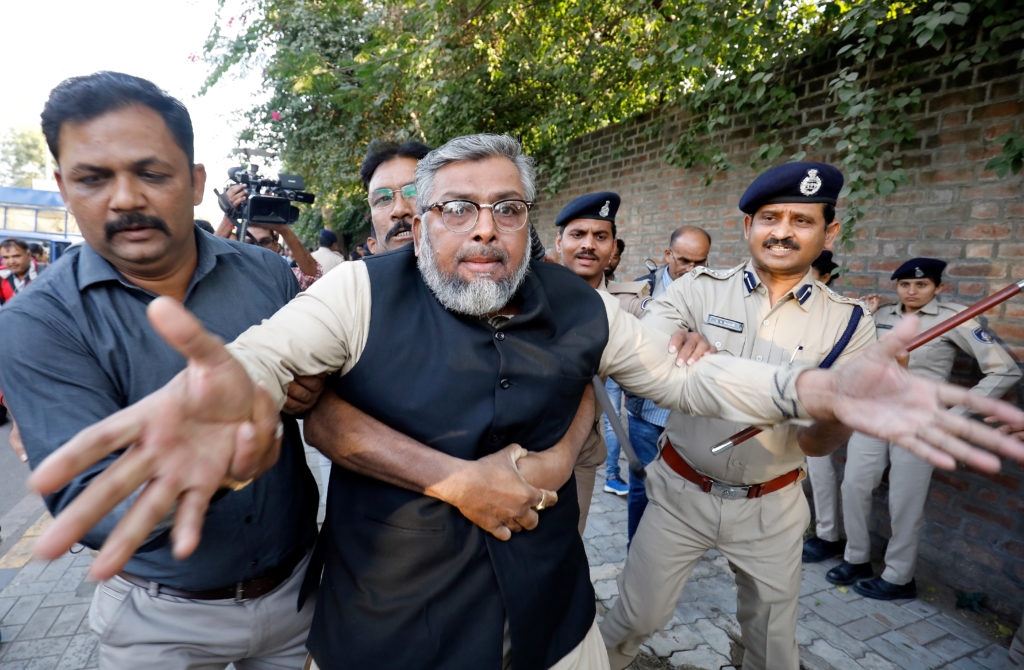 Police detain a demonstrator during a protest to show solidarity with the students of New Delhi's Jamia Millia Islamia uni...