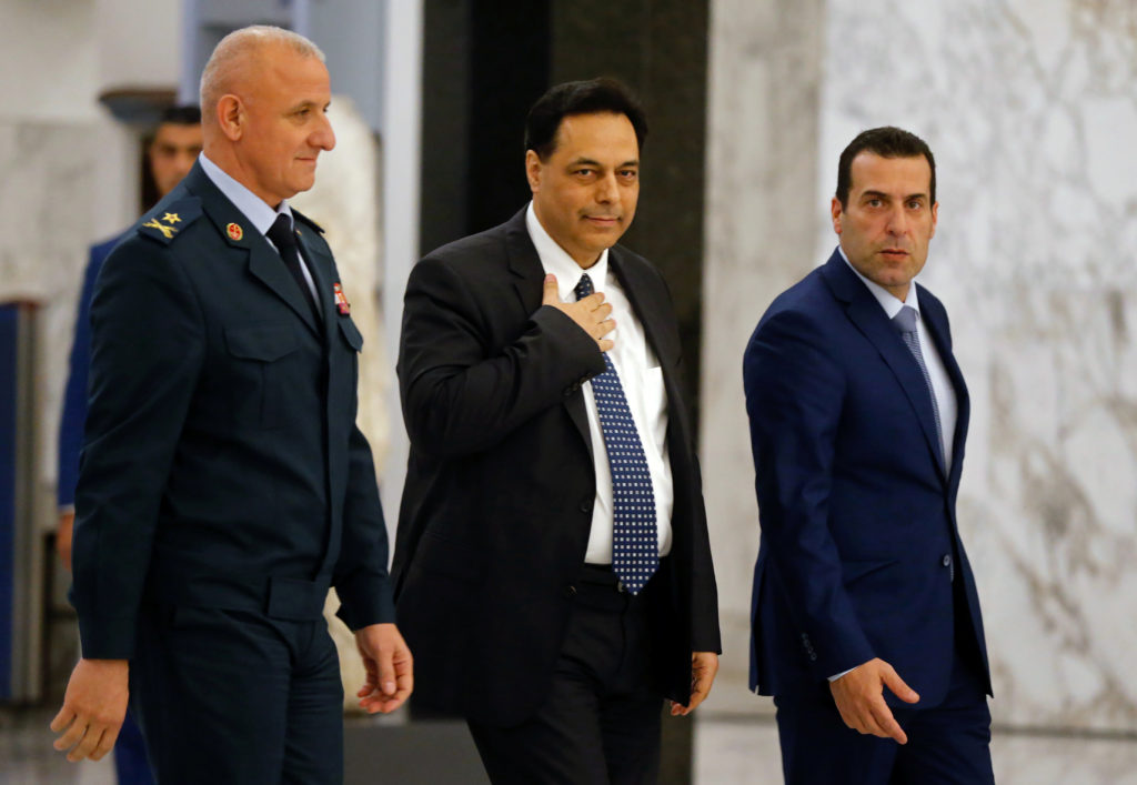 Hassan Diab, Lebanon's newly named prime minister, walks at the presidential palace in Baabda, Lebanon December 19, 2019. ...