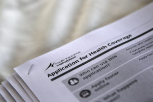 The federal government forms for applying for health coverage are seen at a rally held by supporters of the Affordable Care Act, widely referred to as "Obamacare", outside the Jackson-Hinds Comprehensive Health Center in Jackson, Mississippi October 4, 2013. Jonathan Bachman/REUTERS
