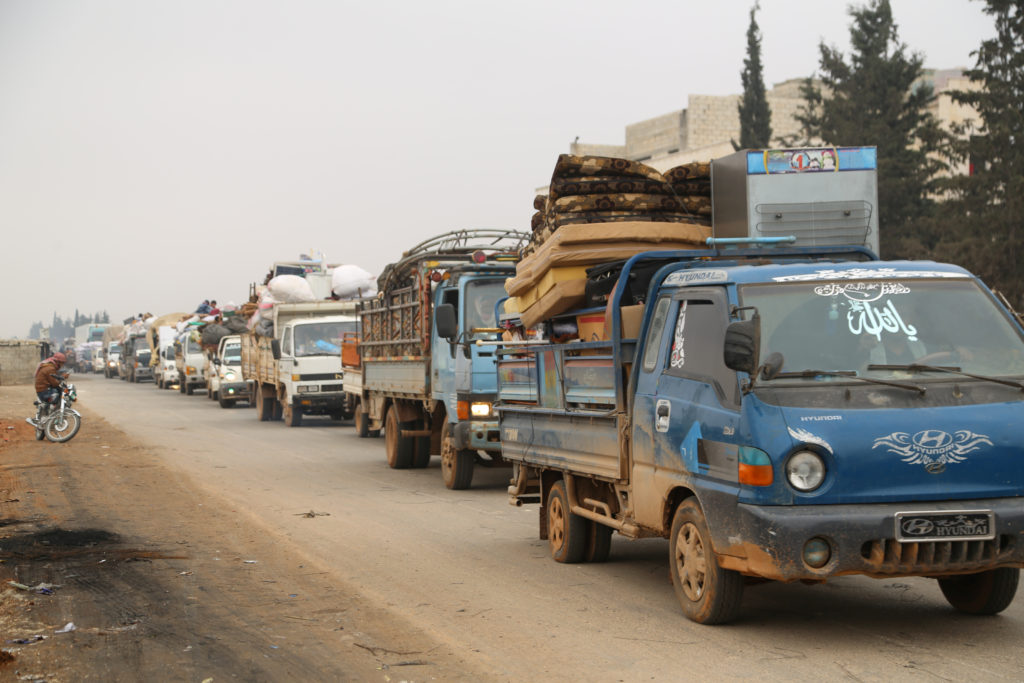 Trucks carry belongings of people fleeing from Maarat al-Numan, in northern Idlib, Syria December 24, 2019. Photo by REUTE...