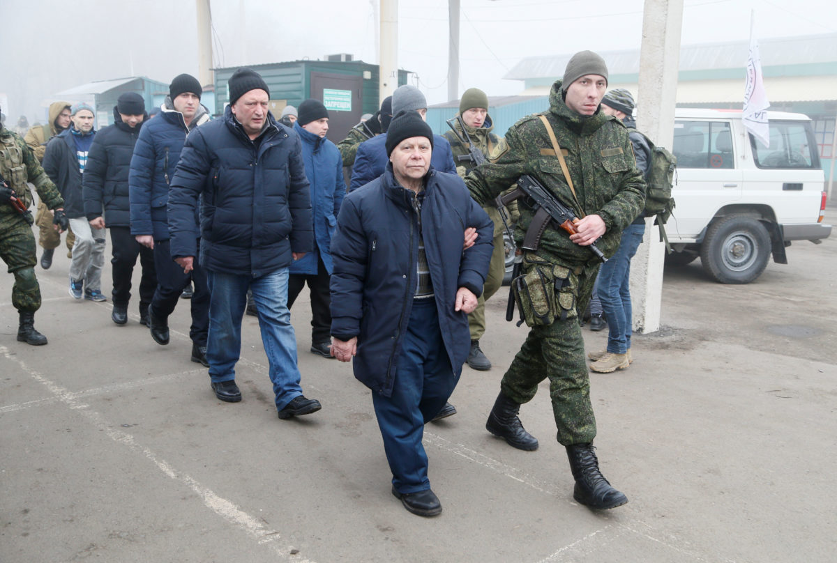 Ukraine, eastern rebels swap prisoners in move to end war PBS News