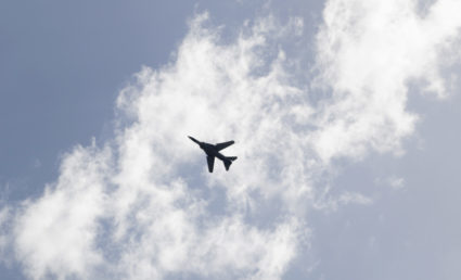 An airplane flies in the sky. Photo by Khalil Ashawi/Reuters