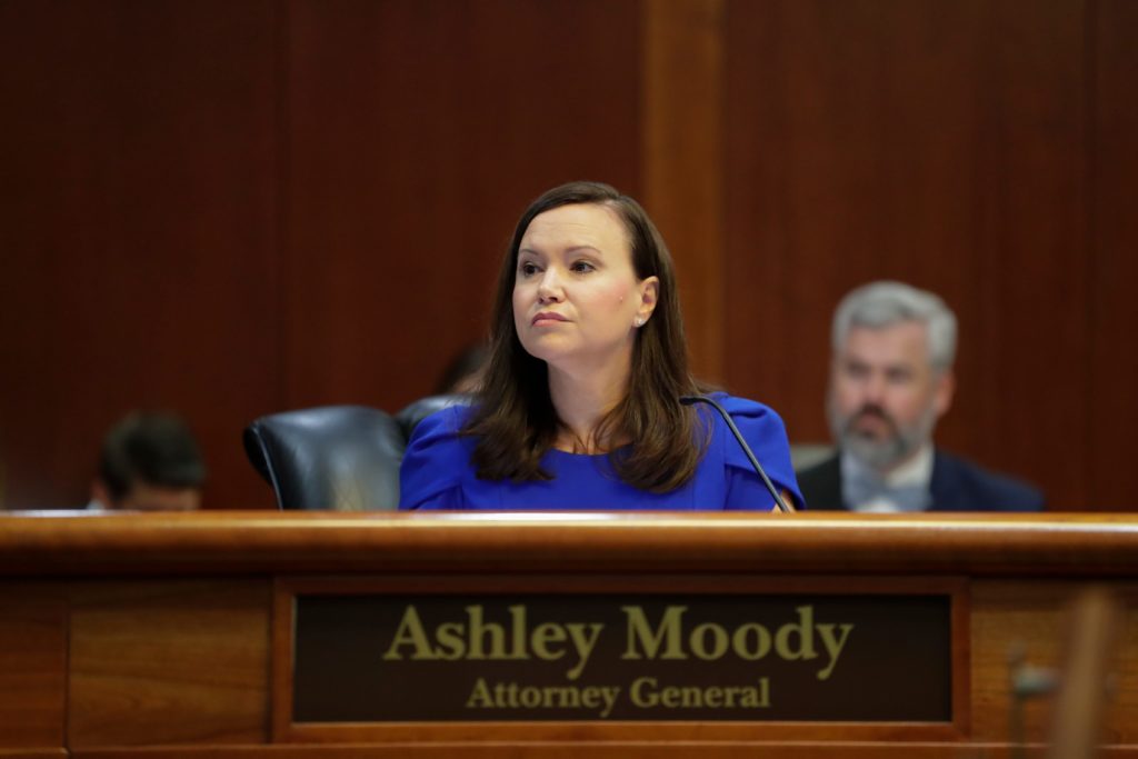 Attorney General Ashley Moody listens as Secretary of the Florida Department of Environmental Protection. Photo by Tori Sc...