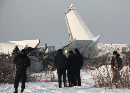 Emergency and security personnel are seen at the site of a plane crash near Almaty, Kazakhstan, December 27, 2019. Photo by Pavel Mikheyev/Reuters