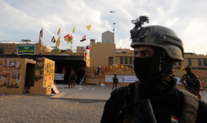 U.S. Embassy in Iraq suspends operations, militiamen withdraw