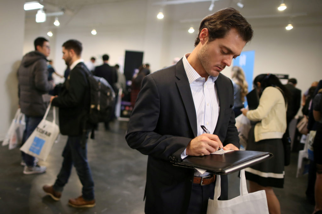 FILE PHOTO: People attend TechFair LA, a technology job fair, in Los Angeles, California, U.S., January 26, 2017. REUTERS/...
