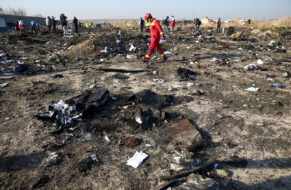 A member of a rescue team walks among debris from a plane belonging to Ukraine International Airlines, that crashed after a take-off from Iran's Imam Khomeini airport, on the outskirts of Tehran, Iran January 8, 2020. Photo by Nazanin Tabatabaee/WANA (West Asia News Agency) via Reuters