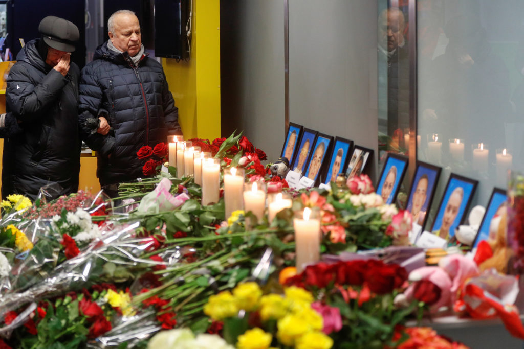 Relatives of the flight crew members of the Ukraine International Airlines Boeing 737-800 plane that crashed in Iran, mour...