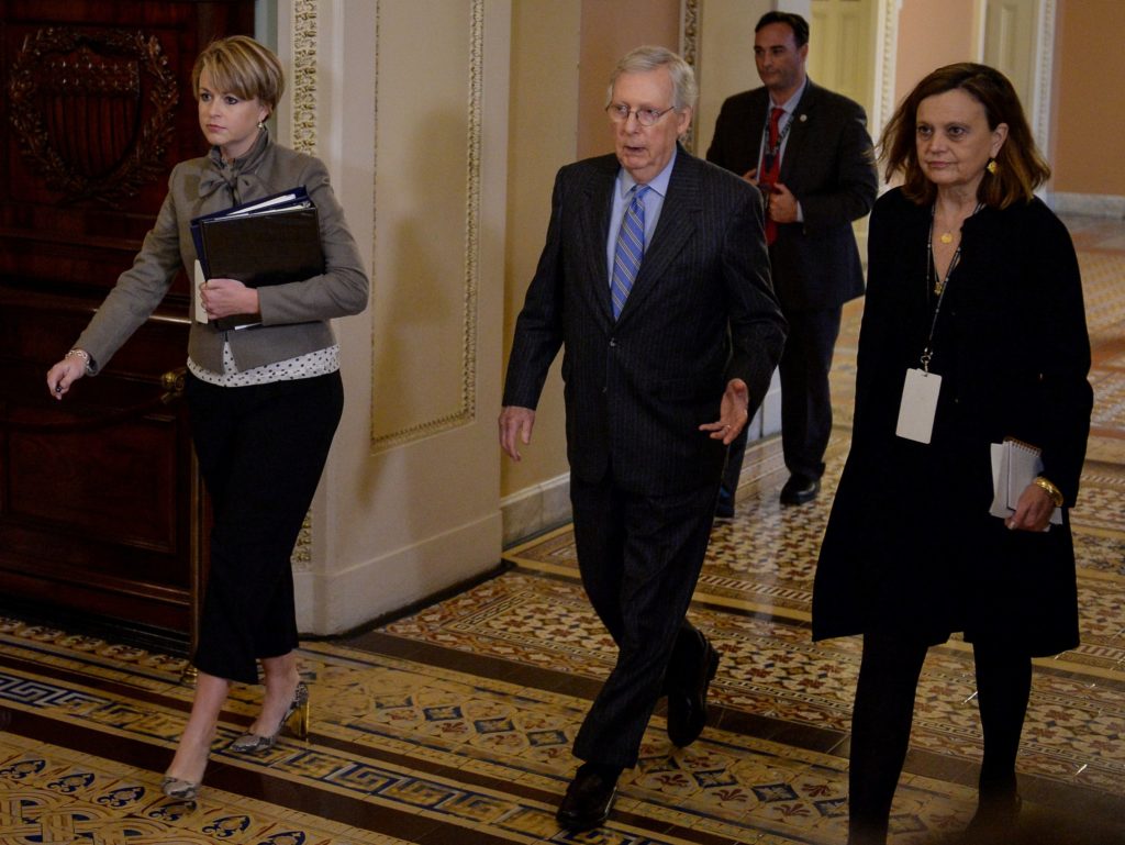 Senate Majority Leader Mitch McConnell (R-KY) walks to the Senate floor after a brief recess during the U.S. President Don...