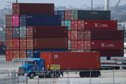 Trucks offload containers from ship at the port of Los Angeles in Los Angeles, California, July 16, 2018. Photo by Mike Blake/Reuters