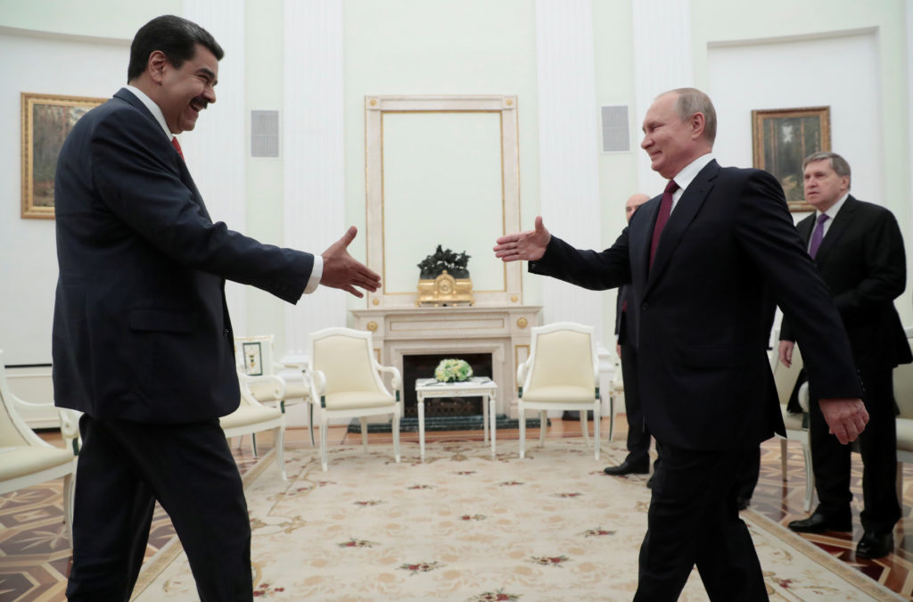 Russian President Vladimir Putin shakes hands with Venezuelan President Nicolas Maduro during a meeting at the Kremlin in ...