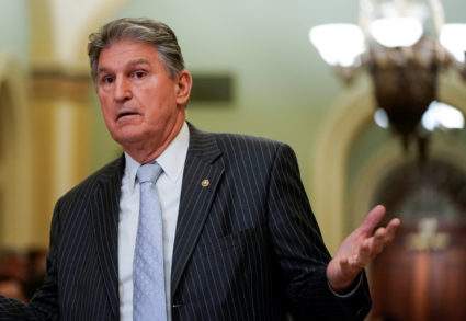 Senator Joe Manchin (D-WV) speaks with an aide during a break in the impeachment trial of U.S. President Donald Trump continues in Washington, U.S., January 24, 2020. Photo by Joshua Roberts/REUTERS