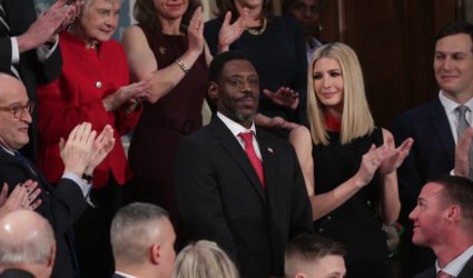 Tony Rankins who lost his job after serving in the U.S. Army is applauded as a guest of U.S. President Donald Trump as he stands next to White House senior advisers Ivanka Trump and Jared Kushner during U.S. President Donald Trump's State of the Union address to a joint session of the U.S. Congress in the House Chamber of the U.S. Capitol in Washington, U.S., February 4, 2020. Photo by Tom Brenner/Reuters