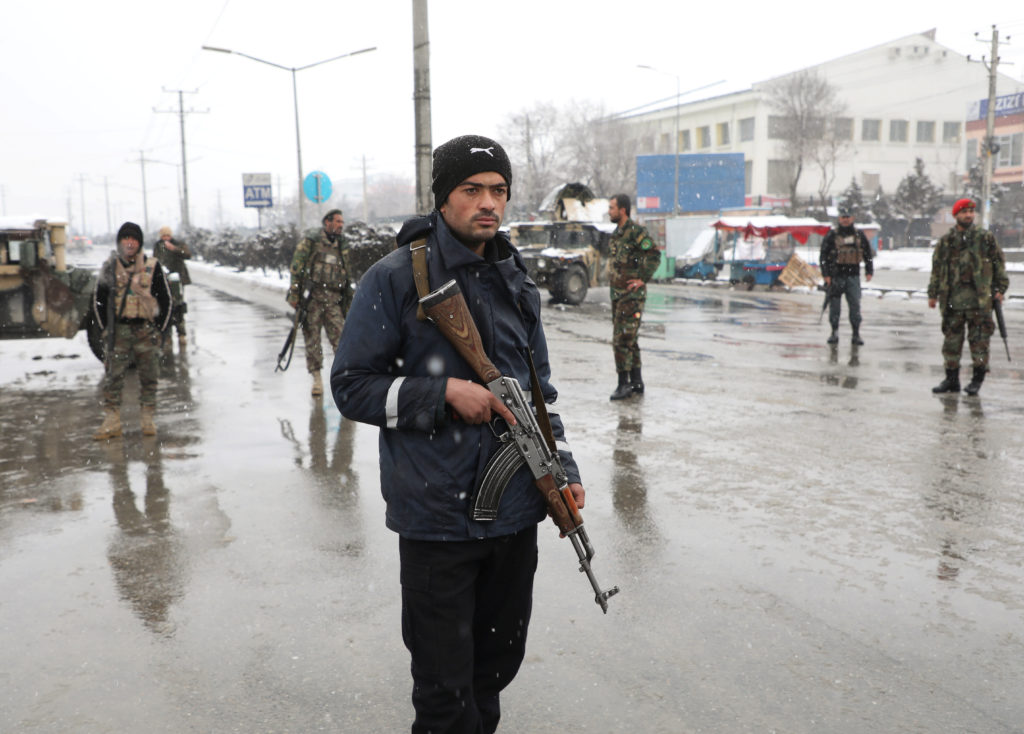 Afghan security forces keep watch near the site of a suicide attack in Kabul, Afghanistan February 11, 2020. Photo by Omar...