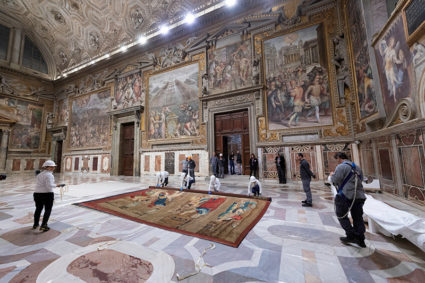 A tapestry designed by Renaissance artist Raphael is installed on a lower wall of the Sistine Chapel at the Vatican as part of celebrations marking the 500th anniversary of his death in this handout photo released in February. Photo by Governatorato SCV/Direzione dei Musei via Reuters