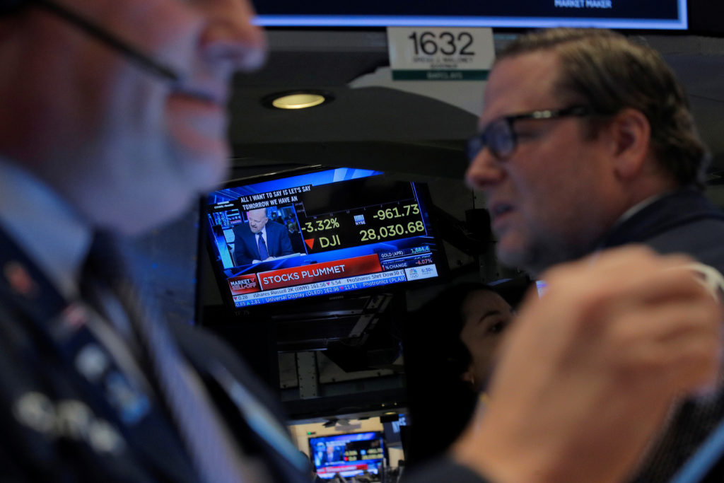 Traders work on the floor at the New York Stock Exchange (NYSE) in New York, February 24, 2020. Photo by Brendan McDermid/...