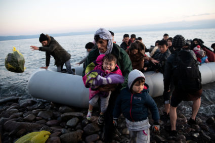 Migrants from Afghanistan arrive on a dinghy on a beach near the village of Skala Sikamias, after crossing part of the Aegean Sea from Turkey to the island of Lesbos, Greece, March 2, 2020. Photo by Alkis Konstantinidis/Reuters