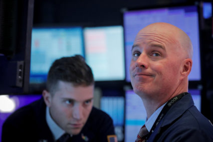Stocks surge after Federal Reserve makes emergency rate cut | PBS NewsHour