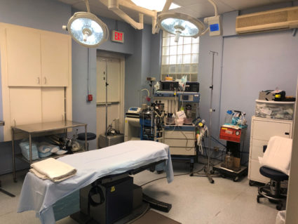 U.S. hospitals rush to find beds for surge of virus patients